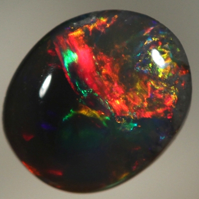 SOLID BLACK OPAL Bright, rich cherry red rolling flashes